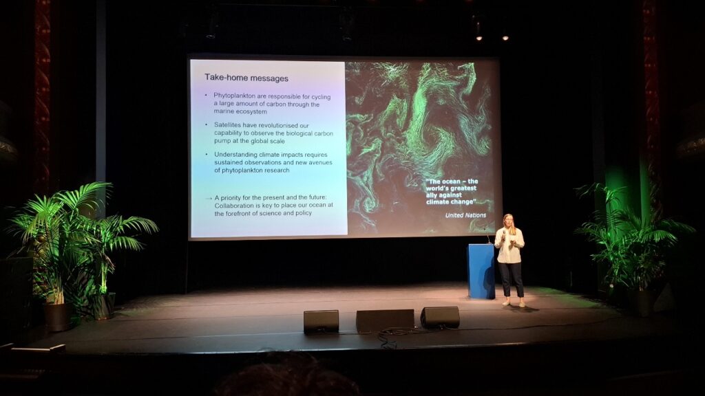 Gemma presenting on stage at Ocean Optics