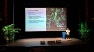 Gemma presenting on stage at Ocean Optics